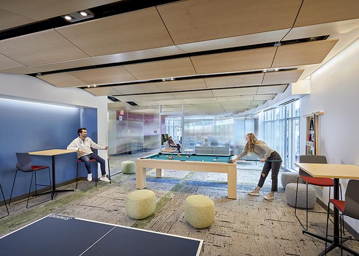 forbes beeler game room with two students playing pool